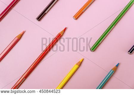 Color Pencils Pattern On A Light Pink Background. Top View With Space For Text. Back To School Conce