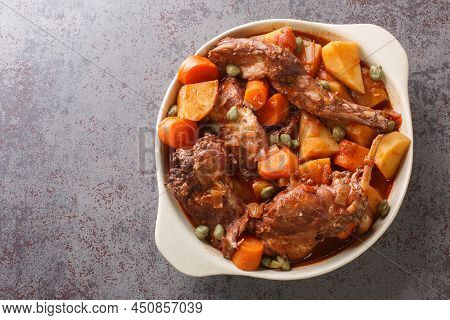 Fenkata Dish Of National Maltese Cuisine Cooked From Rabbit Meat With Vegetables And Gravy Close-up 