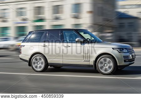 Silver Range Rover L405 Car Moving On The Street On High Speed. Fast Moving Luxury Suv Car On The Hi