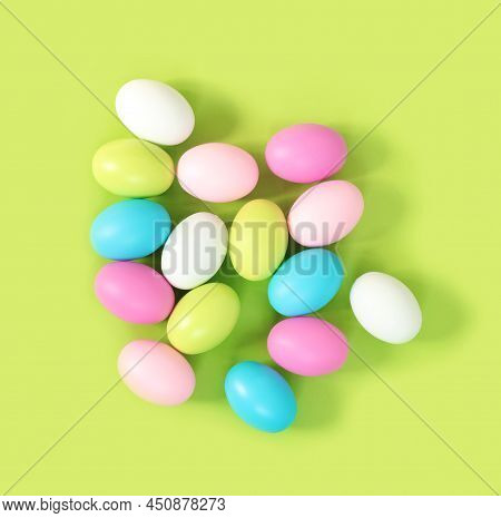 Multicolored Painted Easter Eggs On Green Paper Background. Flat Lay  Top View With Copy Space. Bann