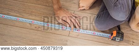Banner, Long Format Father And Son Installing New Wooden Laminate Flooring On A Warm Film Floor. Inf