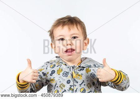 Cute Caucasian Boy Shows Myofunctional Trainer. Dental Tariner Is Made To Help Equalize The Growing 
