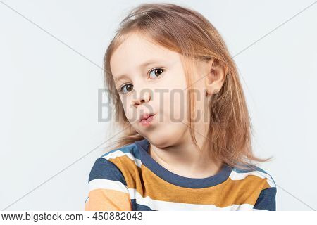 Six-year Old Caucasian Girl Shows Myofunctional Trainer. Dental Tariner Is Made To Help Equalize The