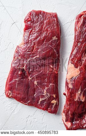 Raw Skirt Steak, Flank Steak, For Bbq  Cut Organic Meat Cut Top View Close Up Over White Concrete Ba