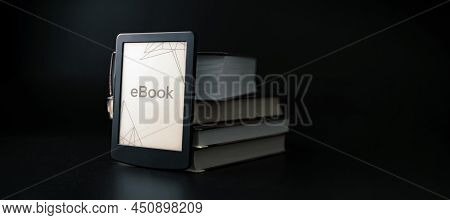 E Reader. Digital E Book, Library Reader Tablet With Books On Dark Background. Online Education Cour