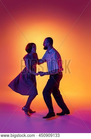 Portrait Of Excited Man And Woman, Couple Of Dancers In Vintage Retro Style Outfits Dancing Lindy Ho