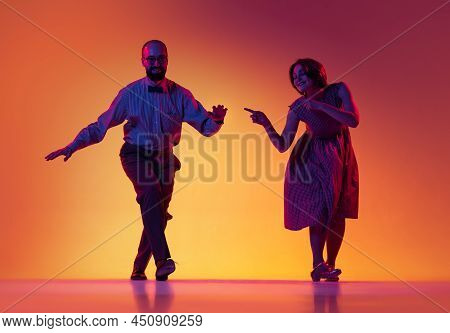 Portrait Of Excited Man And Woman, Couple Of Dancers In Vintage Retro Style Outfits Dancing Lindy Ho