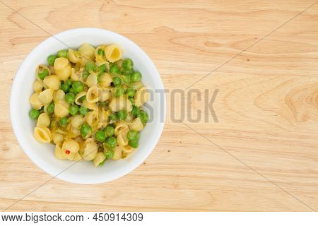 Small Cooked Shell Pasta Salad In A Bowl Isolated On Wood Table