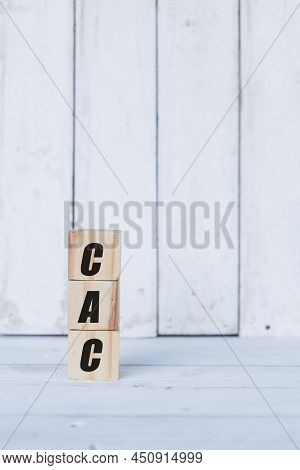 Cac Concept Written On Wooden Cubes Or Blocks, On White Wooden Background.