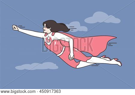 Smiling Young Mother In Superhero Costume Fly In Sky. Happy Active Motivated Mom In Hero Suit Show P
