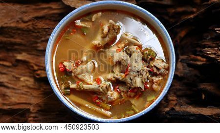 Chicken Feet Spicy Soup (tom Yum Gai) Thai Native Spicy Food In White Bowl On Wooden Background, Tha