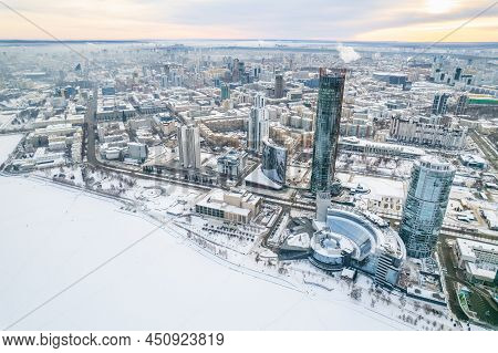 Yekaterinburg Aerial Panoramic View In Winter At Sunset. Yekaterinburg City And Pond In Winter.