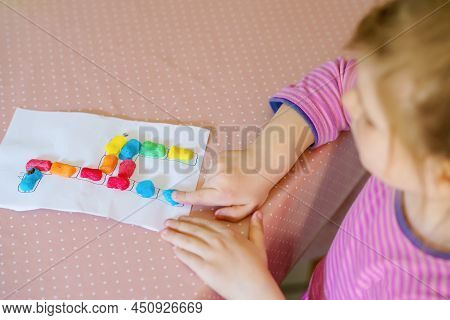 Little Creative Toddler Girl Making Colorful Giraffe With Playmais. Active Happy Child Having Fun Wi
