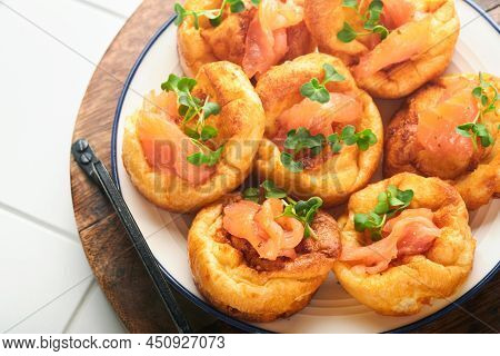 Yorkshire Pudding. Traditional English Yorkshire Pudding With Salmon And Radish Microgreens Side Dis