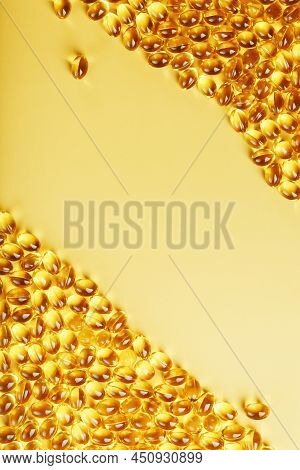 Capsules In A Shell With Liquid Vitamin D3 On A Yellow Background And A Place For Text
