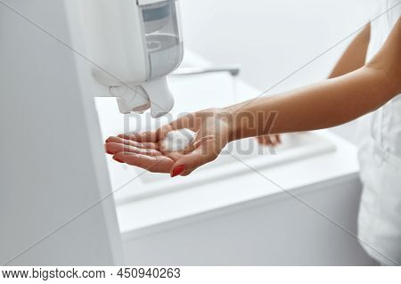 Doctor Washing Hands Before Operating In Hospital. Health Care And Hygiene Concept