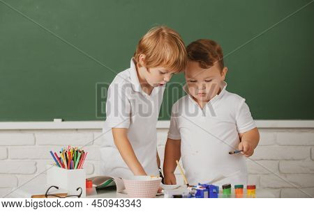 Portrait School Kids Bosy Doing Art Homework, Holding Pencil, Writing. Children Pupils Drawing On El