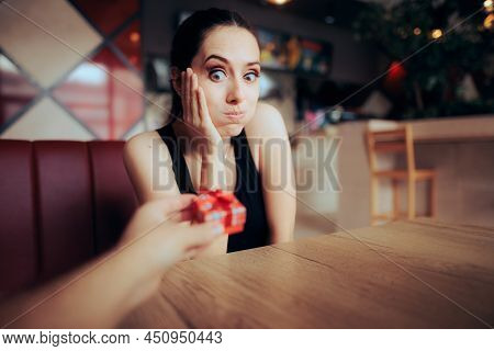 Funny Girlfriend Receiving A Small Gift On A Date