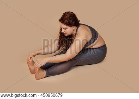 Red Curly Haired Melancholy Calm Fat Obesity Woman Flabs Not Hamstring Muscles And Spin, Stretching.