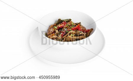 Wok Noodles With Seafood Isolated On A White Background. Pasta With Shrimp And Mussels.