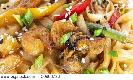 Wok Noodles With Seafood. Pasta With Shrimp And Mussels.