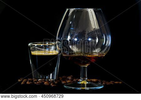 Den Helder, The Netherlands. January 2022. Close Up Of Coffee, Beans With Cognac On Black Background