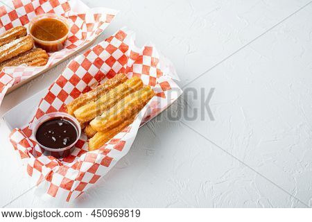Fried Crullers In Brown, Take Away Bag  In Paper Tray, On White Background With Space For Text, Copy