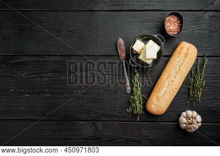 Ingredients For Garlic And Gerbs Bread Baguette Set, On Black Wooden Table Background, Top View Flat