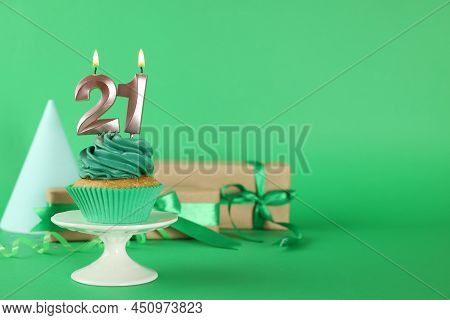 Delicious Cupcake With Number Shaped Candles On Green Background, Space For Text. Coming Of Age Part