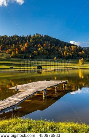 autumn pond under the mountains, Murau district,
Styria, Austria