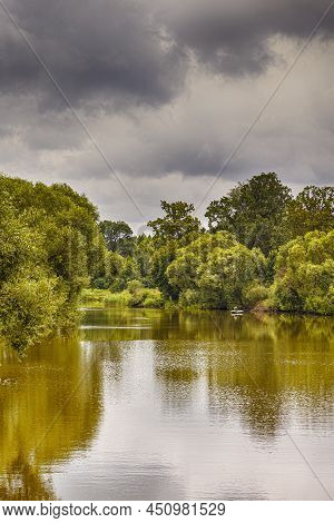 Belarussian Travel Places. One Old Tiny Fisherman In Boat On River Fishing In Dukora In Belarus.