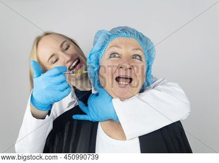 Botulinum Toxin Injection. Senior Woman At The Appointment With A Beautician Who Is Preparing To Giv