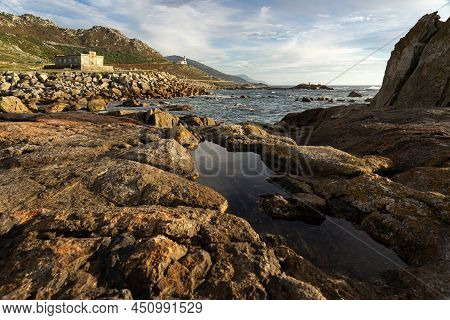 Silleiro Cape And Old And New Lighthouses At Sunset In Ponteverdra, Galicia, Spain