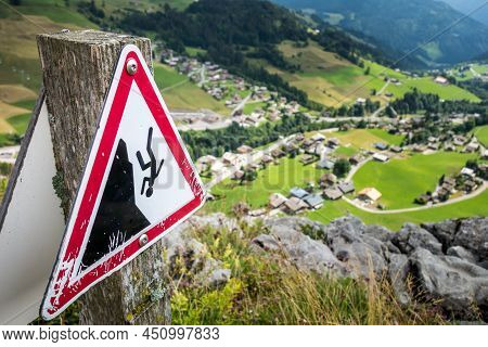 Fall Danger Warning Sign Near A High Cliff