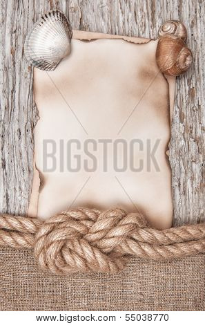 Aged Paper With Ship Rope And Seashells On The Old Wood