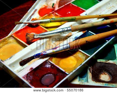 Paints and brushes close