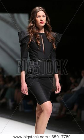 ZAGREB, CROATIA - MAY 09: Fashion model wearing clothes designed by Avaro Figlio on the Zagreb Fashion Week on May 09, 2014 in Zagreb, Croatia.