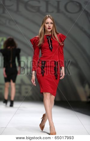 ZAGREB, CROATIA - MAY 09: Fashion model wearing clothes designed by Avaro Figlio on the Zagreb Fashion Week on May 09, 2014 in Zagreb, Croatia.