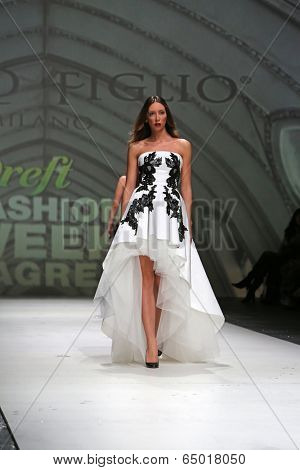 ZAGREB, CROATIA - MAY 09: Fashion model wearing clothes designed by Avaro Figlio on the Zagreb Fashion Week on May 09, 2014 in Zagreb, Croatia.