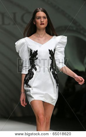 ZAGREB, CROATIA - MAY 09: Fashion model wearing clothes designed by Avaro Figlio on the Zagreb Fashion Week on May 09, 2014 in Zagreb, Croatia.