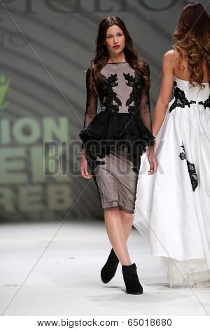 ZAGREB, CROATIA - MAY 09: Fashion model wearing clothes designed by Avaro Figlio on the Zagreb Fashion Week on May 09, 2014 in Zagreb, Croatia.