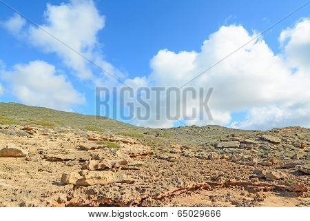 Clouds And Rocky Hill