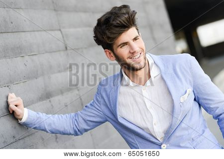 Attractive Young Handsome Man, Model Of Fashion In Urban Background