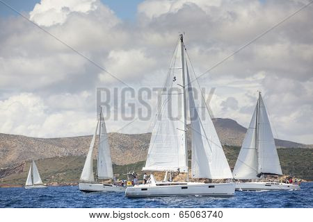 AEGEAN SEA, GREECE - APR 27, 2014: Unidentified sailboats participate in sailing regatta 