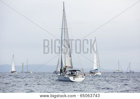 AEGEAN SEA, GREECE - APR 27, 2014: Unidentified sailboats participate in sailing regatta 