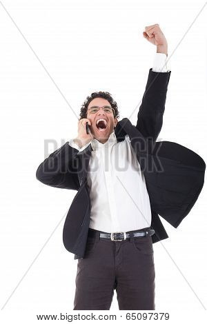 Man In A Suit  Talking On Mobile Phone And Showing Sign Of Success With His Handup In The Air