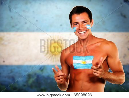 Cheering argentinian soccer fan over argentina flag background
