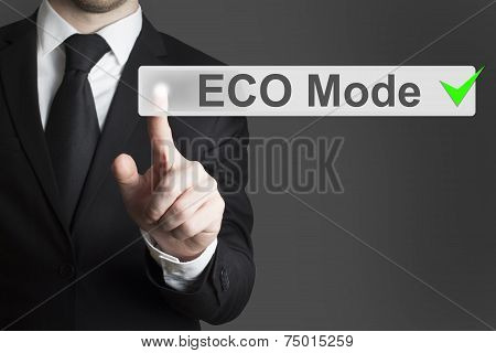 Businessman Pushing Touch Screen Button Eco Mode