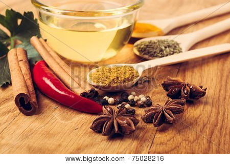 spices, cinnamon and pepper on wooden table