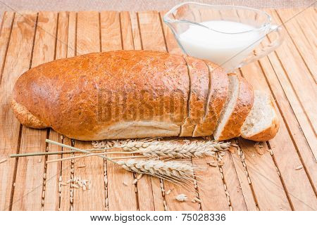 Fresh bread with grains and milk